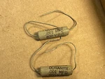 2 Nos Vintage 1950S Aerovox .001 Uf 600V Duranite Capacitors Gray Molded Caps. Fixed Price $5.00.