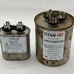 Lot Of 2 Assorted Titan Hd Motor Run Capacitors POC10A And PRCFD5575A. Fixed Price $18.00.
