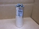 Hartland HCKY600D075R370217Z 60+7.5 Mfd X 370V Round Dual Run Capacitor (186054). Fixed Price $5.00.