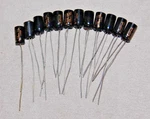 (QTY12) Nos Calrad 20 Mfd 15 Vdc Radial Electrolytic Capacitor. Fixed Price $9.50.